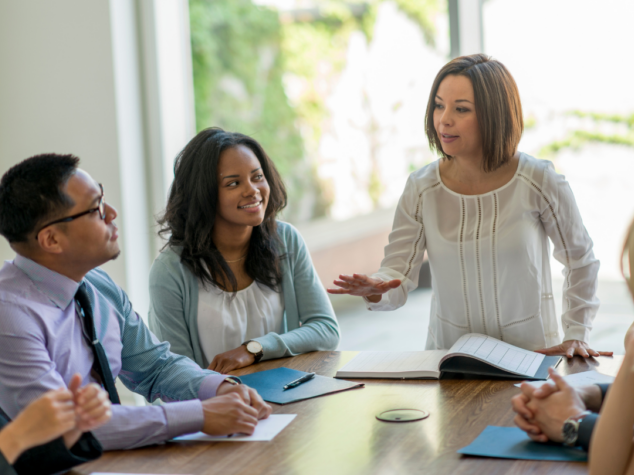 Emotionally intelligent leader facilitating team meeting